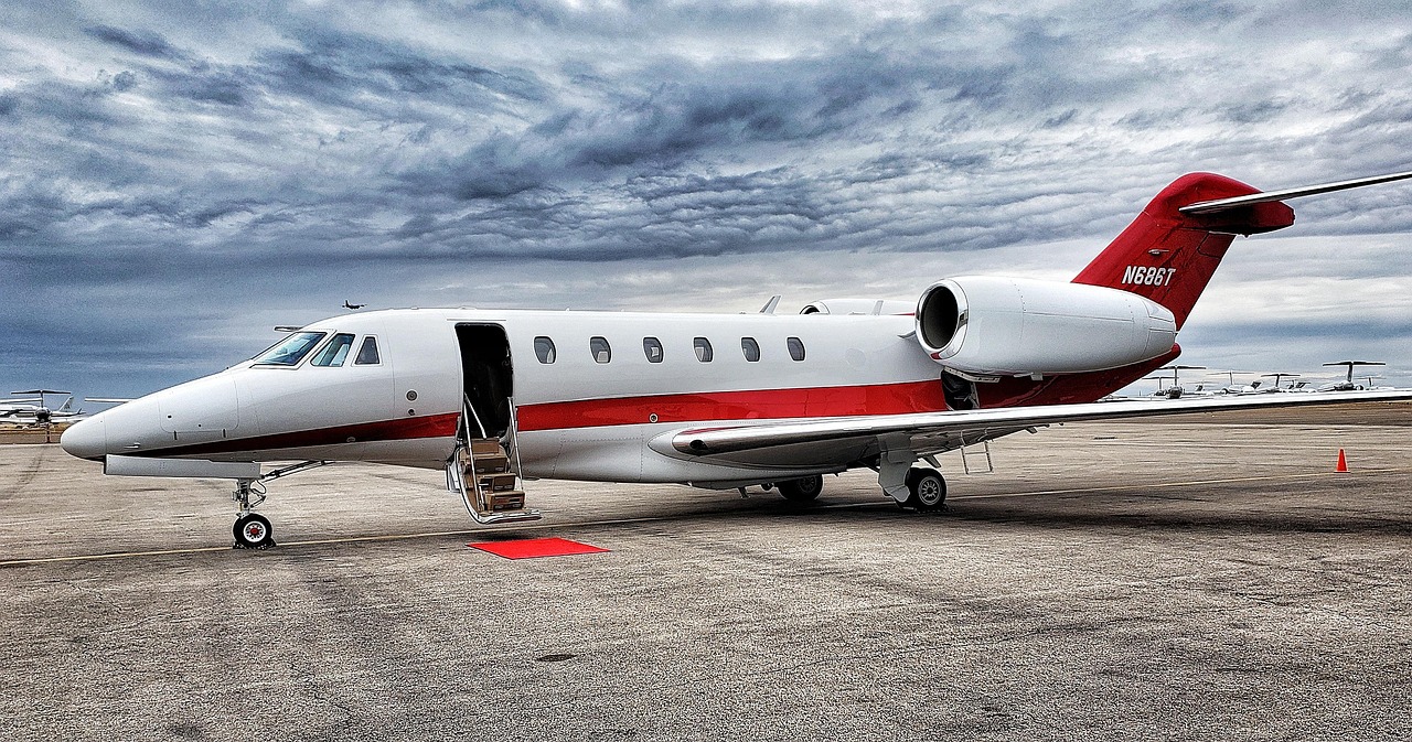 Luxury midsize business jet parked on an airport ramp under dramatic skies, representing Gulfstream financing, aircraft hangar financing, midsize business jet loans, midsize jet purchase loans, and challenger jet financing for private aircraft owners, charter operators, and corporate aviation buyers.