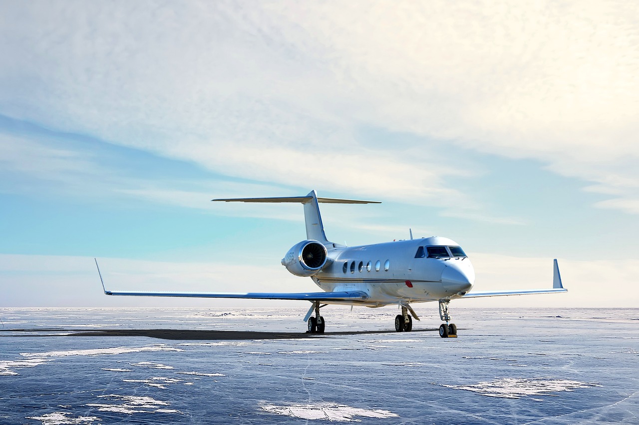 Luxury midsize business jet parked on a snowy airport runway, representing midsize jet financing, midsize business jet loans, ultra long range jet financing, aircraft acquisition financing, and aircraft ownership financing solutions for corporate and private aviation buyers.