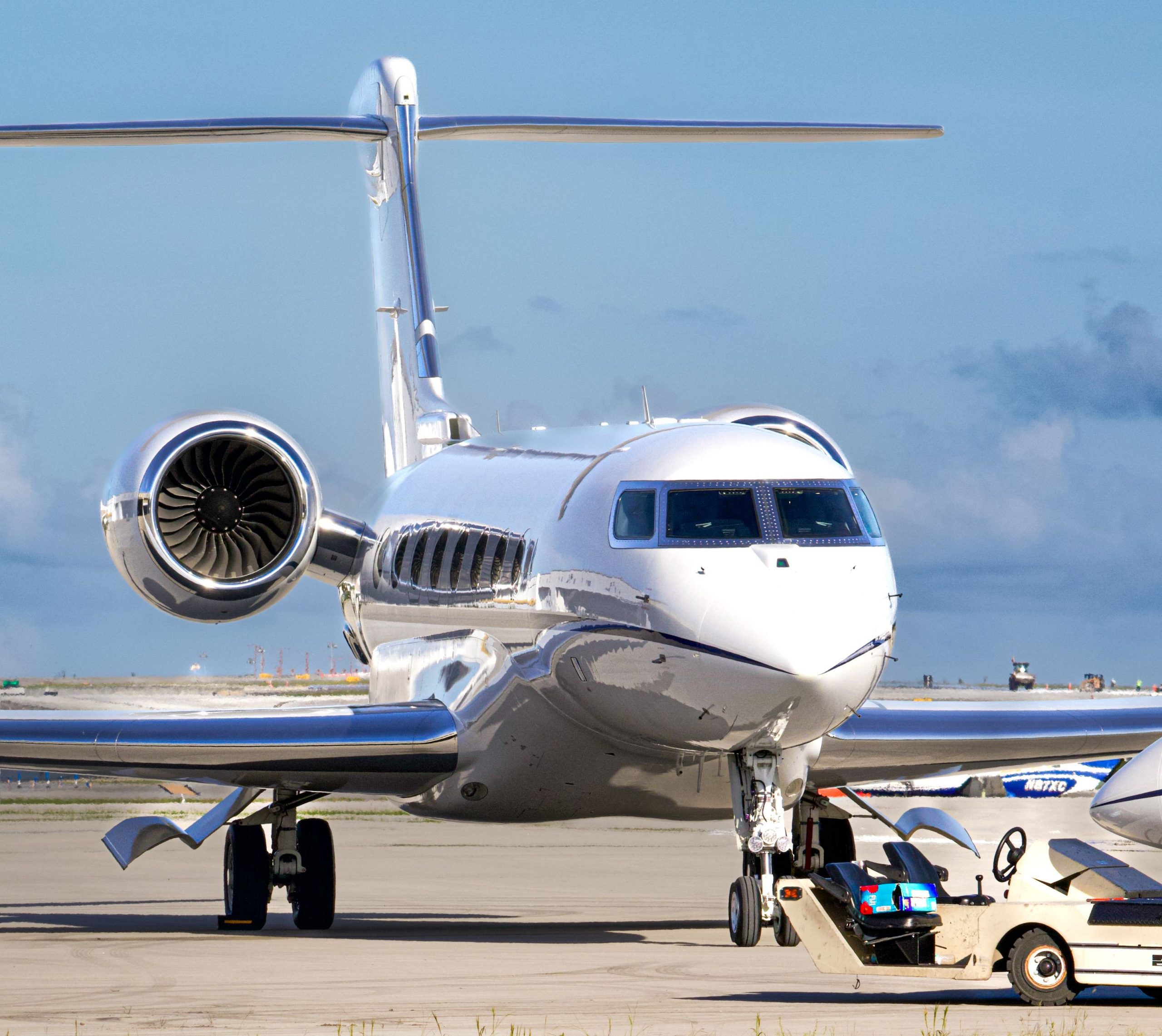Luxury business jet parked on an airport apron, representing jet share financing, charter fleet financing, midsize aviation financing, co ownership aircraft financing, and aircraft technology upgrade loans for aviation investors, charter operators, and private aircraft owners seeking advanced aviation funding solutions.