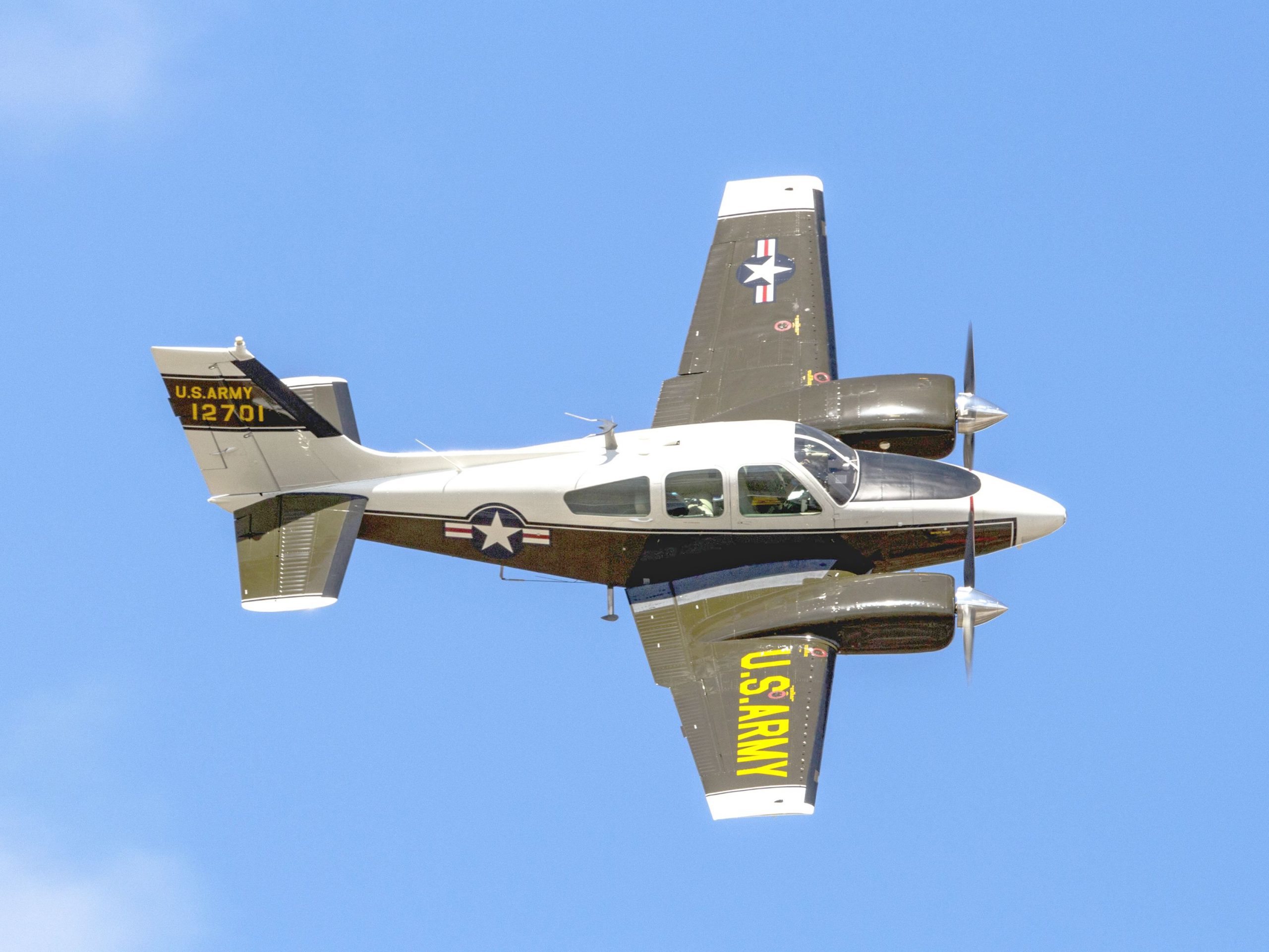 Beechcraft twin-engine aircraft in flight against a clear blue sky representing Beechcraft Financing, Cessna 172 financing, corporate jet financing, business jet purchase financing, and charter aircraft financing solutions for private pilots, aviation businesses, and corporate flight departments.