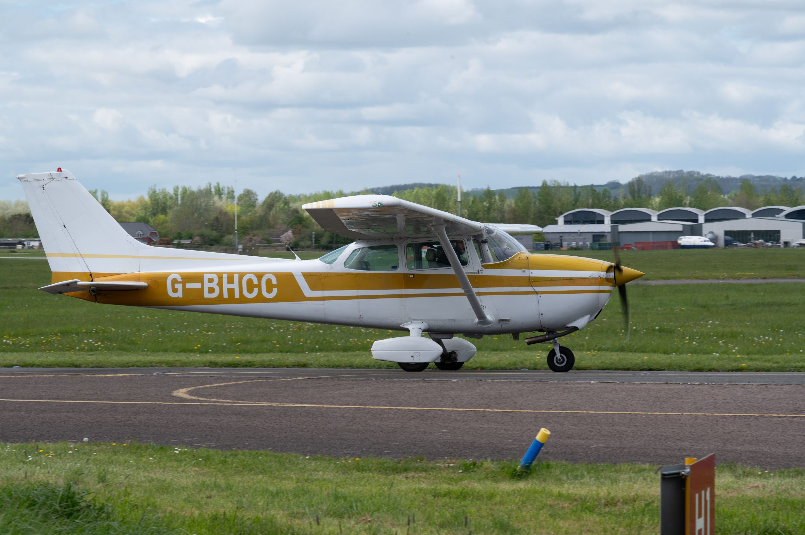 Single-engine aircraft on an airport taxiway illustrating Cessna plane financing, luxury jet financing, aircraft refurbishment financing, aviation real estate financing, and hangar construction financing for private pilots, aviation businesses, and aircraft owners.
