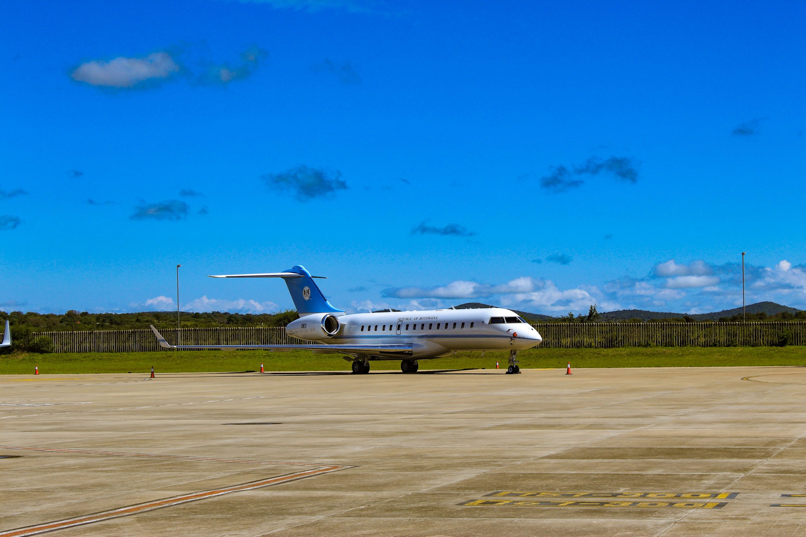 Embraer business jet parked on an airport ramp under a clear blue sky, representing Embraer jet financing, corporate jet leasing, aircraft modernization financing, aircraft renovation funding, and Pilatus aircraft financing solutions for private owners, charter operators, and corporate aviation departments.
