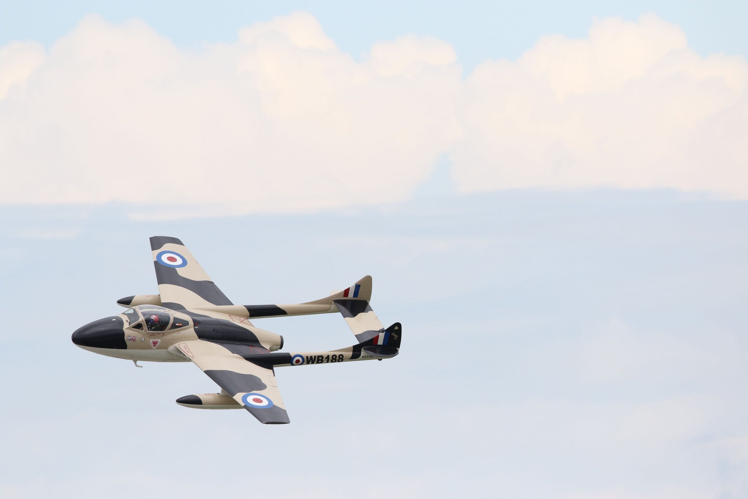 Vintage light jet aircraft flying through a clear sky, representing light jet financing, global travel jet financing, very light jet financing, midsize aircraft ownership financing, and entry level jet financing solutions for private pilots, businesses, and aviation enthusiasts.